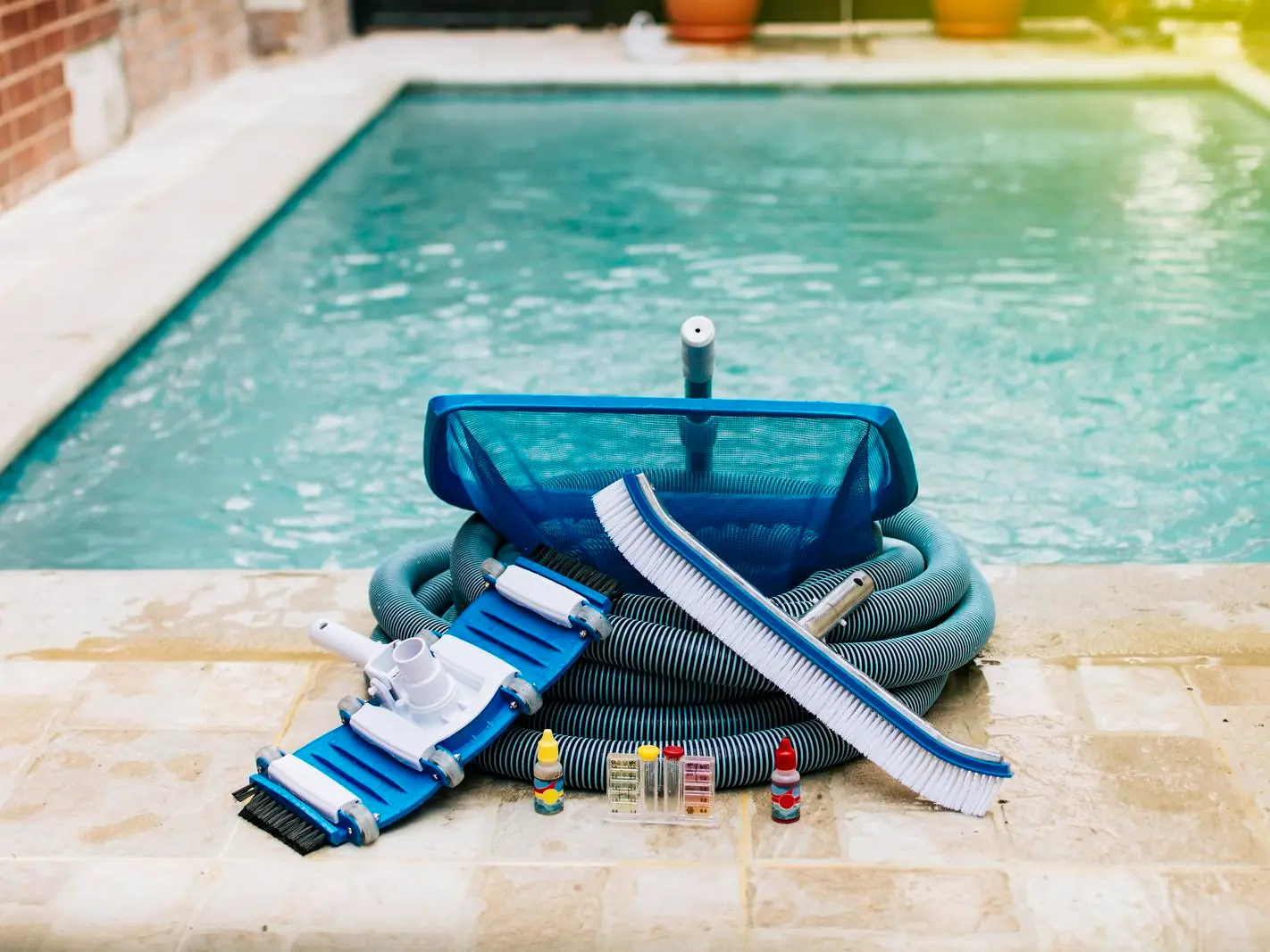Pool maintenance equipment and accessories: essential tools for keeping your pool clean and well-maintained. Pool maintenance equipment and accessories: brushes, nets, vacuum heads, chemicals, and test kits.